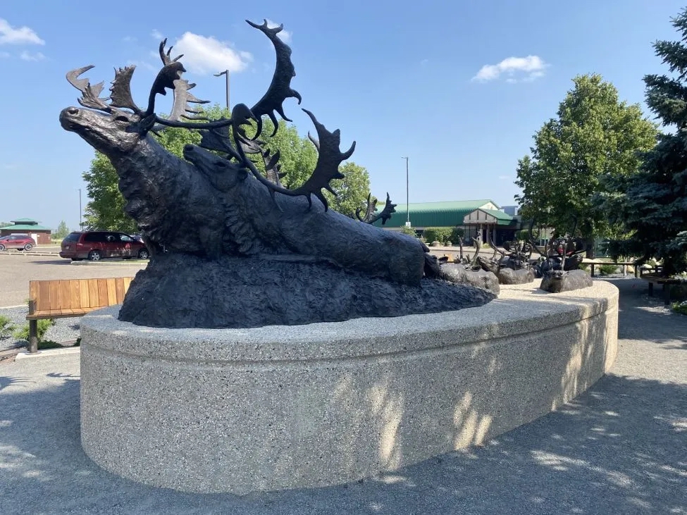 Sculptor Peter Sawatzky's bronze sculpture of caribou crossing a river
